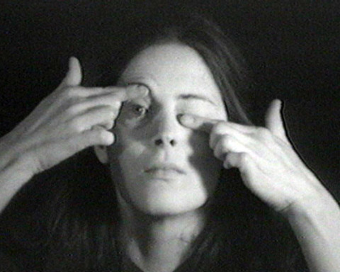 A woman manipulating her own eyelids.