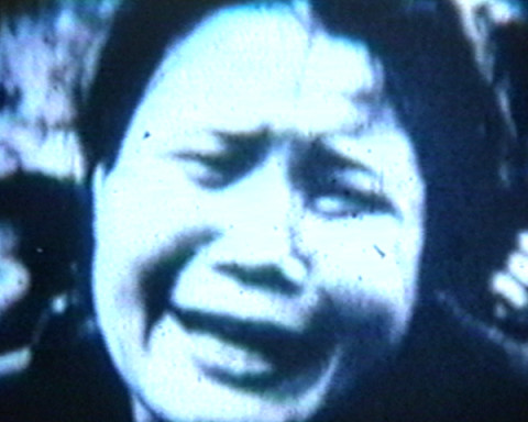 Film still of woman crying